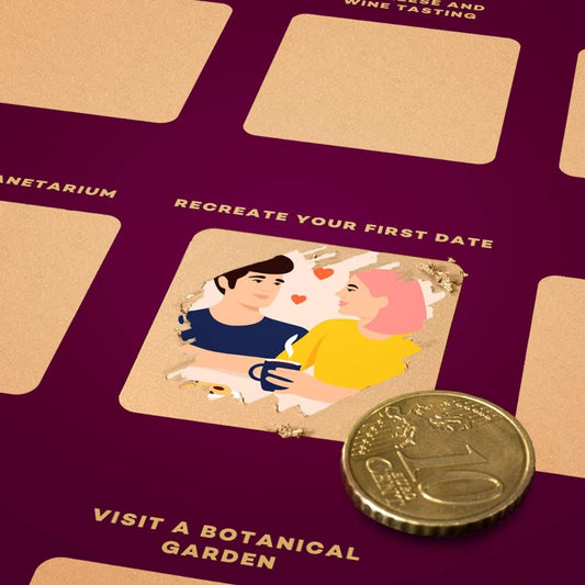 Close-up of a date night scratch off poster with illustration of a couple holding hands and a coin on a purple background
