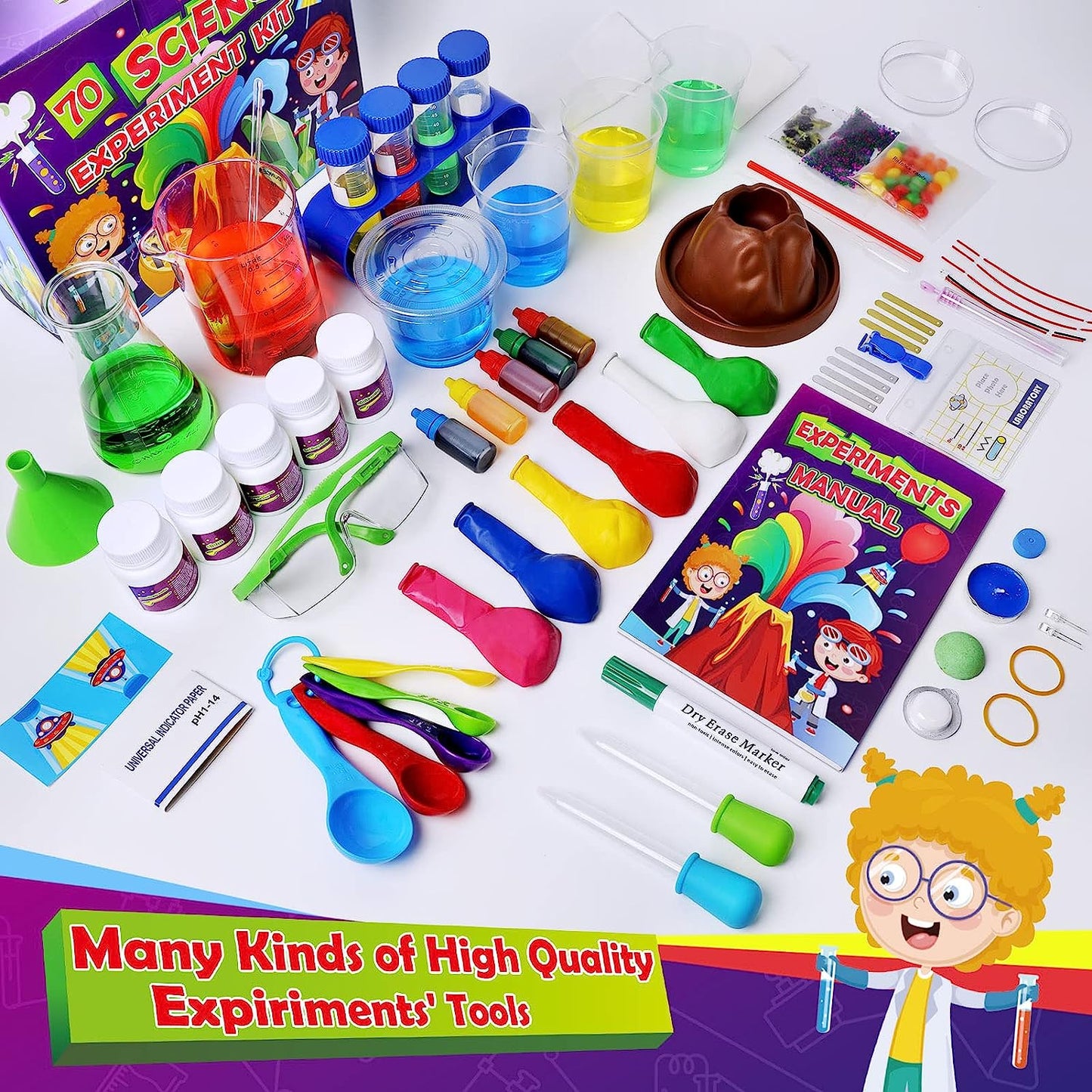 A kids lab science kit which includes 70 different experiments. All the items from inside the kit are laid out on a table.