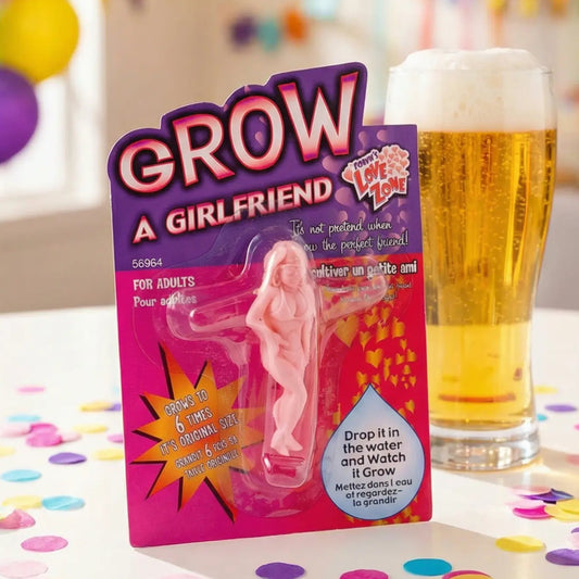 Product packaging for 'Grow a Girlfriend' toy with a glass of beer and confetti in the background.