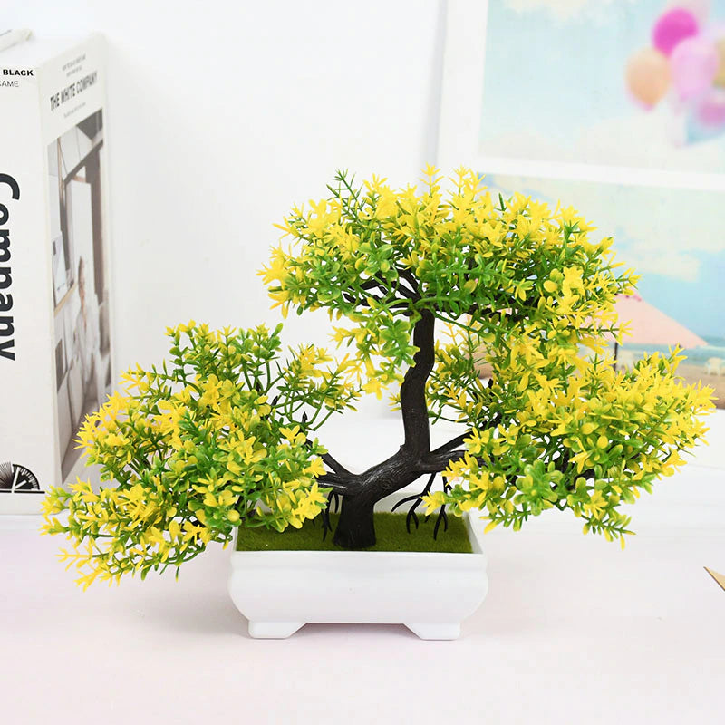 A green and yellow artificial Bonsai tree.