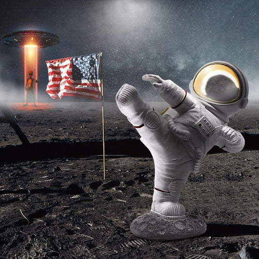 Astronaut figurine on the moon with an American flag and a UFO in the background
