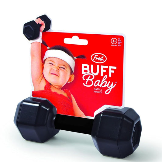 A black dumbbell shaped baby rattle with a 'Buff Baby' toy packaging featuring a child lifting the rattle.
