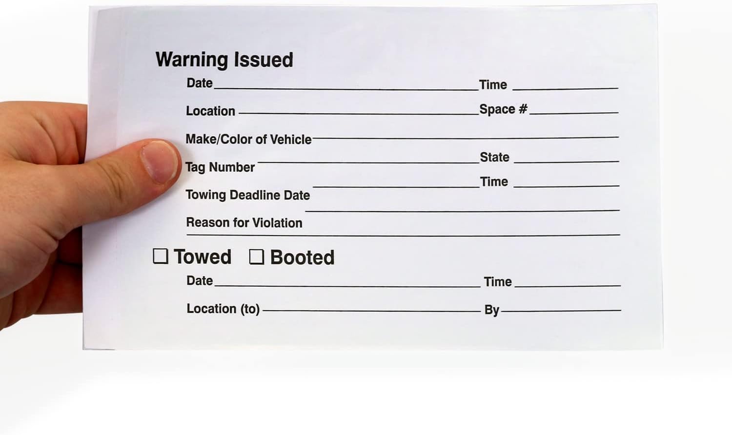 A hand holding a white parking violation form with blank fields for vehicle details, violation reason, and towing or booting information.