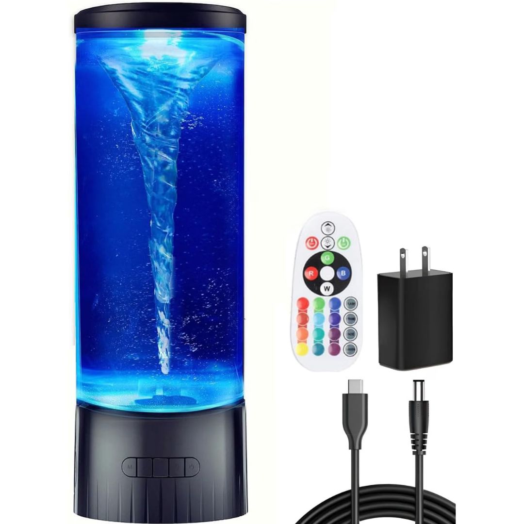 A cylindrical LED water tornado lamp with a swirling blue water vortex, shown with a white remote control, a black wall charger, and a black USB cable on a white background.