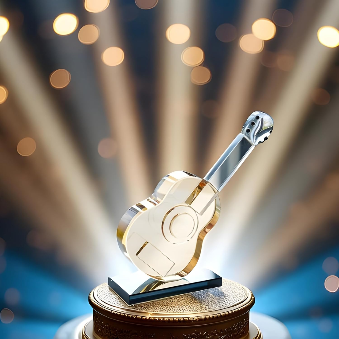 Glass guitar sculpture with lights in the background