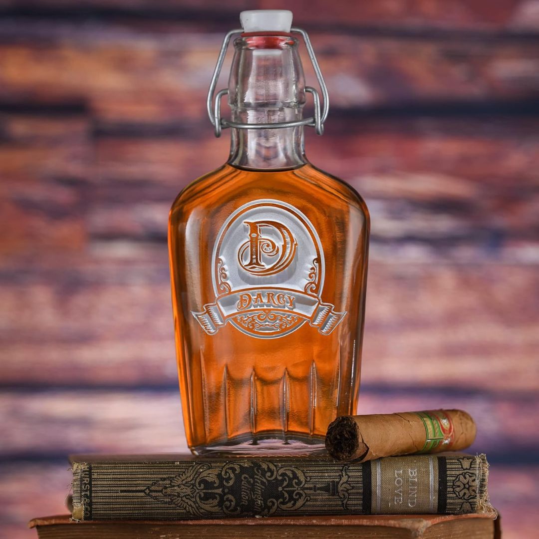 Custom engraved glass bottle of whiskey on a wooden surface with a blurred background