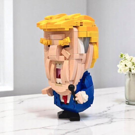 Toy block figure of Donald Trump made of interlocking bricks on a marble surface with a light gray background