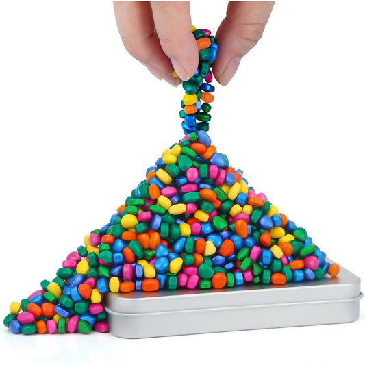 Colorful ferrite putty being stretched over a metallic container on a white background