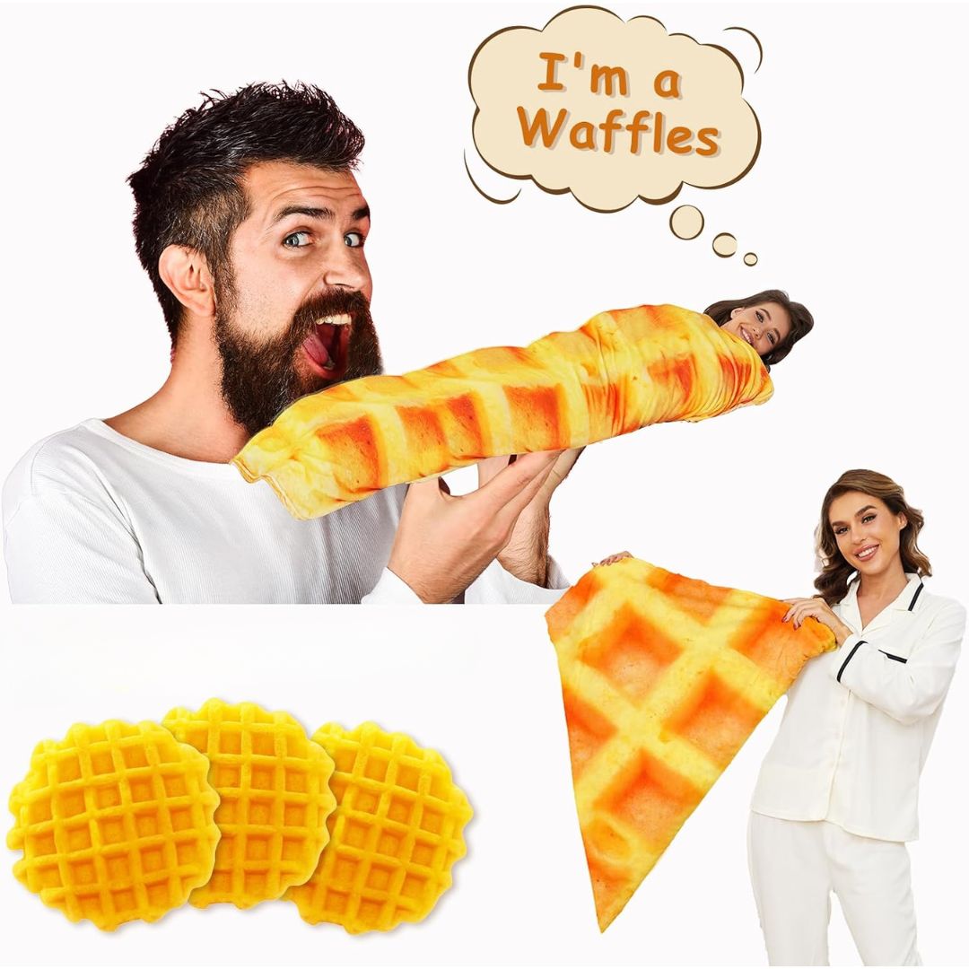 A novelty waffle-shaped plush blanket shown in a collage with two people wearing white pajamas, one holding the pillow like a waffle and the other lying wrapped inside it. The image also includes three round waffle-shaped blankets and a triangular waffle-shaped blanket on a plain white background, with a speech bubble that says 'I'm a Waffles'.