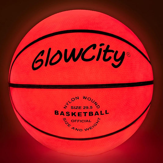A Glowcity glow in the dark basketball which is lit up.