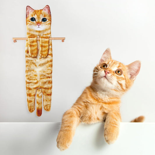 Cat-shaped plush hand towel next to a real cat on a white background