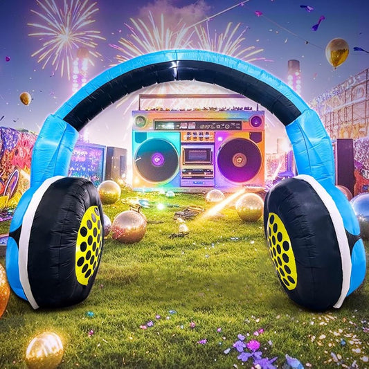 Inflatable headphones and boombox with fireworks and balloons in the background