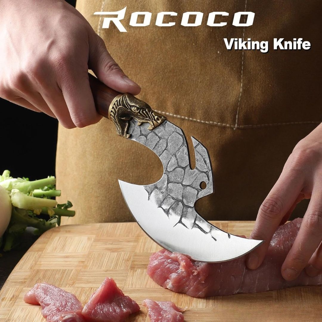 Viking style cleaver knife slicing meat on a wooden cutting board for BBQ and kitchen prep
