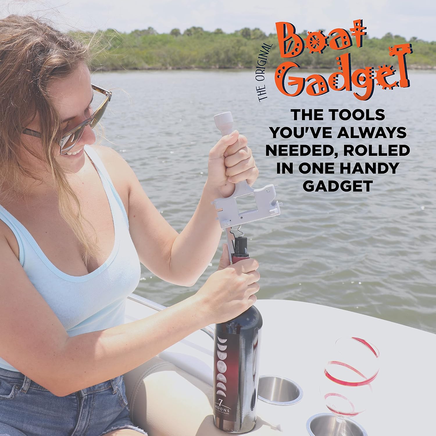 A woman on a boat uses a multi-tool gadget to open a wine bottle, with water and greenery in the background. Text highlights the tool’s features.