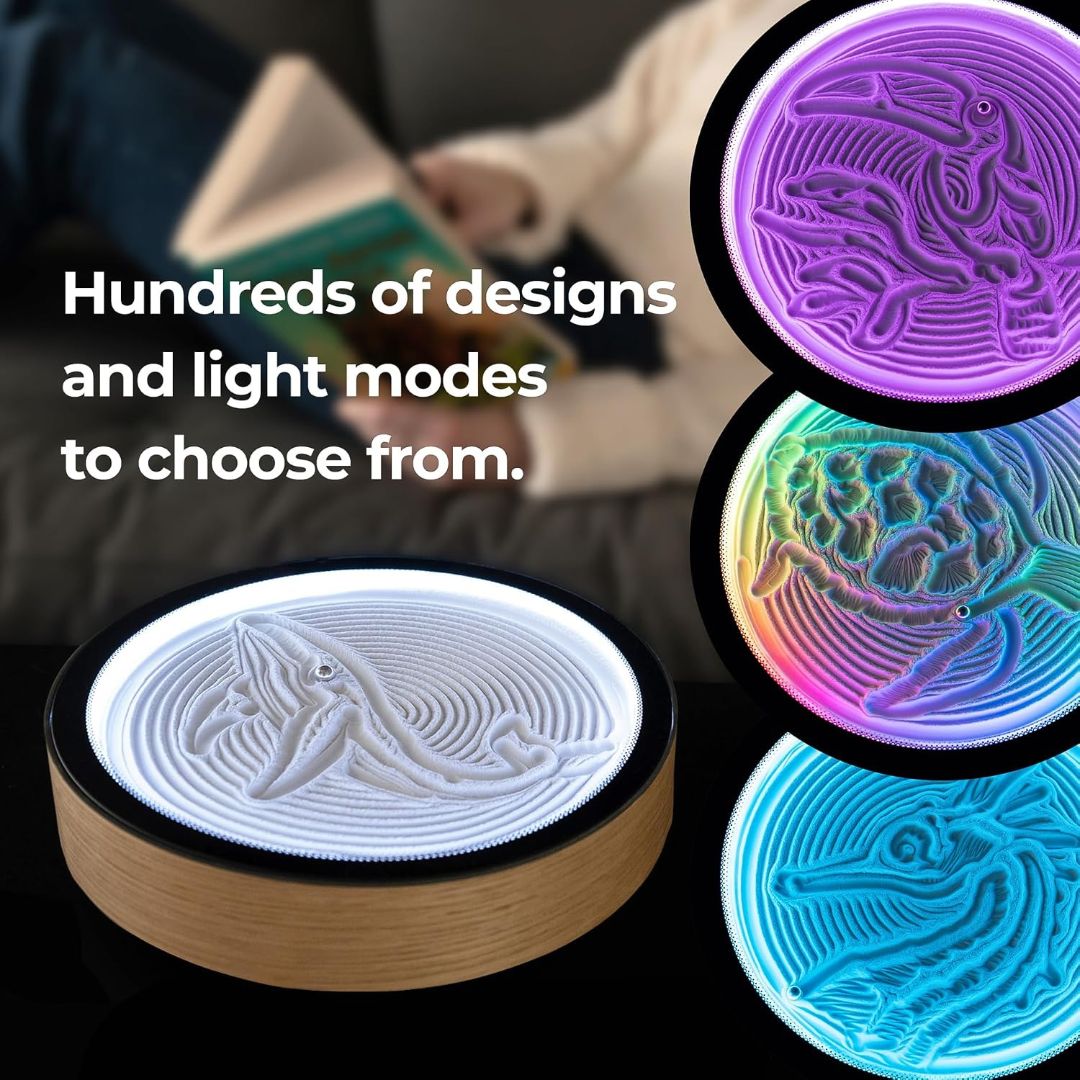 Oasis Mini kinetic sand art table displaying illuminated animal designs and multiple color light modes