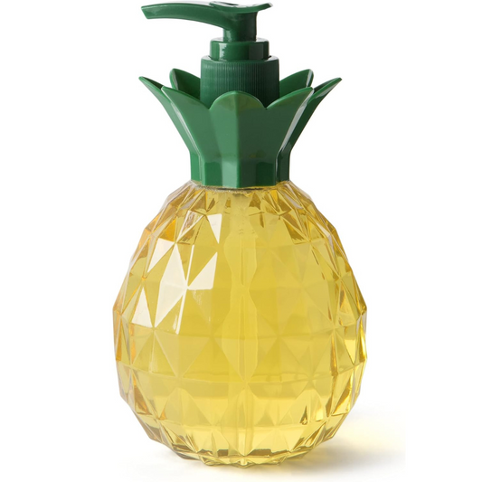 A pineapple-shaped soap dispenser with a faceted yellow body resembling a real pineapple and a green pump top designed to look like pineapple leaves. The dispenser is filled with yellow liquid soap, adding to its tropical aesthetic.