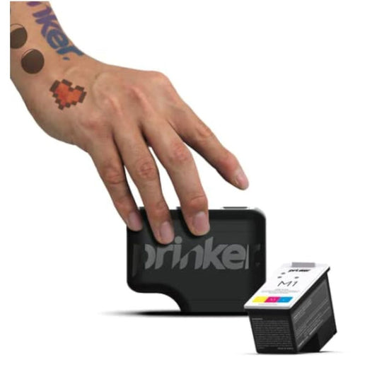 A hand with temporary tattoos is shown touching a black device, with a small black and white M1 ink cartridge placed in front on a white background.