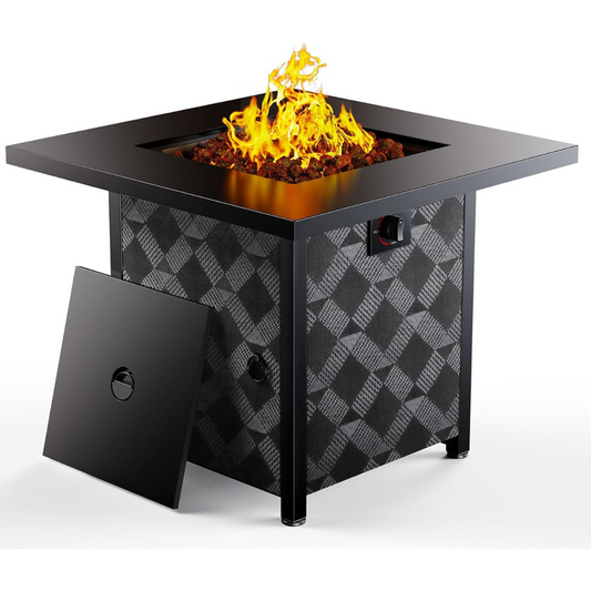 Square black outdoor fire pit with plaid-patterned sides, showing bright flames and lava rocks on top, with a removable panel leaning against it.