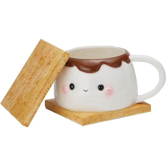 Cute ceramic mug with a smiling face, chocolate topping, and coaster which looks like a s'more on a white background