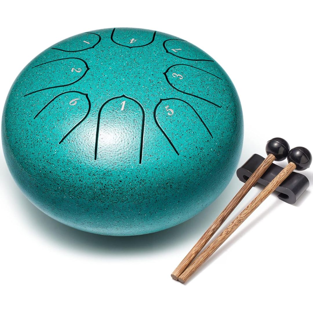 Turquoise steel tongue drum with mallets on a white background