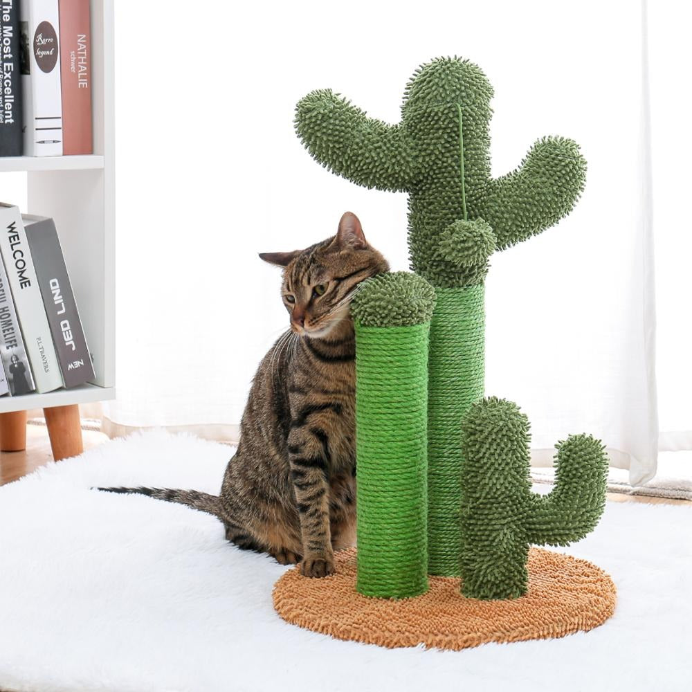 A stripy cat is rubbing its cheek on a cactus shaped cat scratching pole.