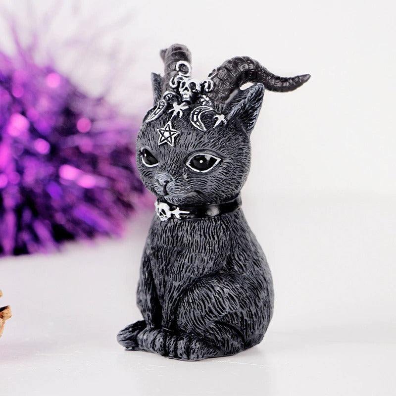 A black cat wizard figurine with horns.