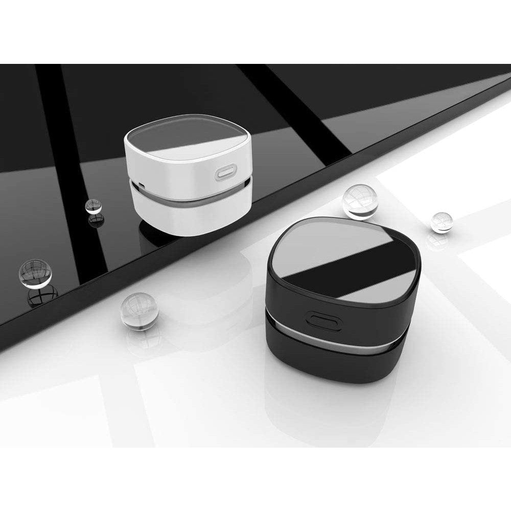 A white and a black desktop vacuum cleaner.