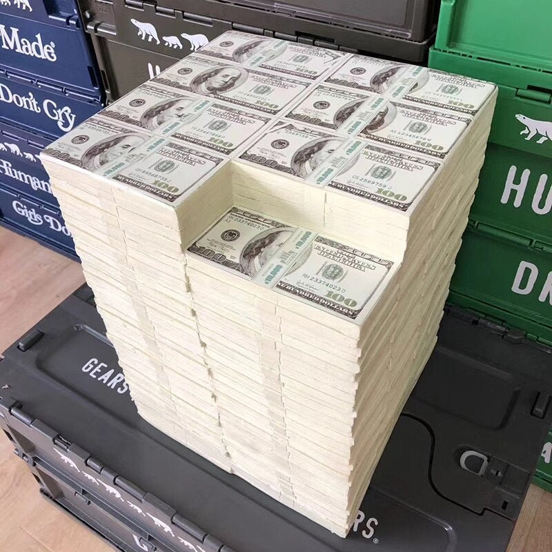 A chair made up of fake 100 dollar bill bank bundles.