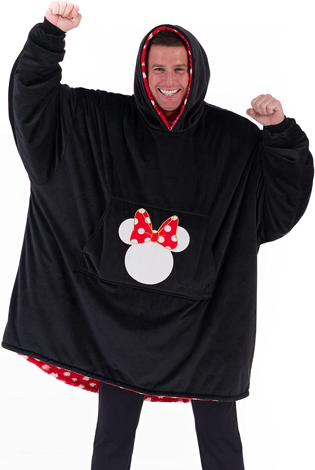 A man is smiling while wearing a black colored giant oversized wearable blanket.
