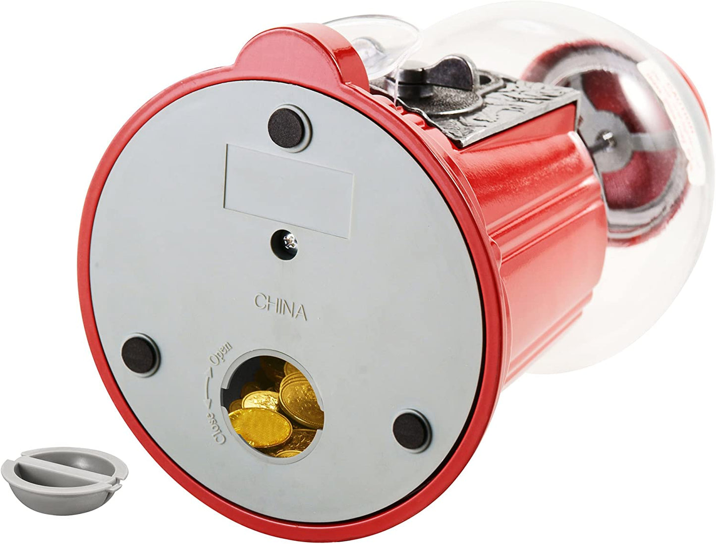 The base of an old fashioned gumball dispenser showing the bank of coins hiding in the base of the machine.