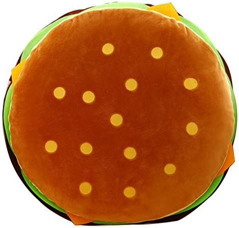 A view from above of a hamburger pillow showing the top of the sesame bun.