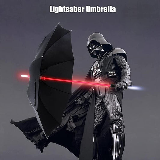 Darth Vader is holding a black umbrella which has a handle shaped like a red lightsaber