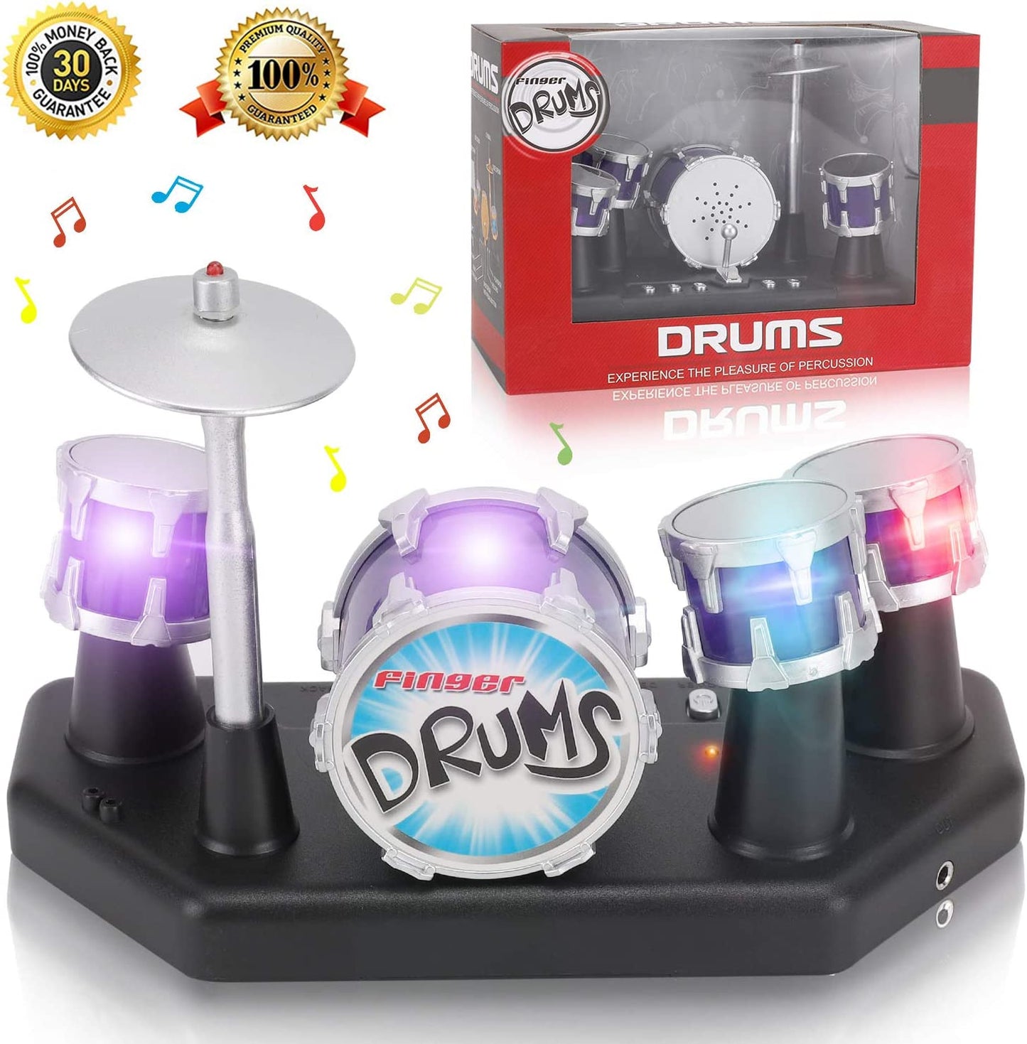 A mini finger drum set with colorful lights on. In the background you can see the packaging for the drum set.