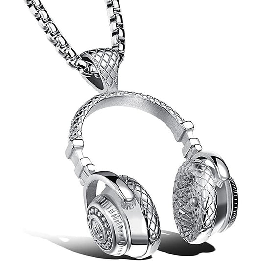 A silver colored chain and pendant. The pendant is a pair of music headphones.