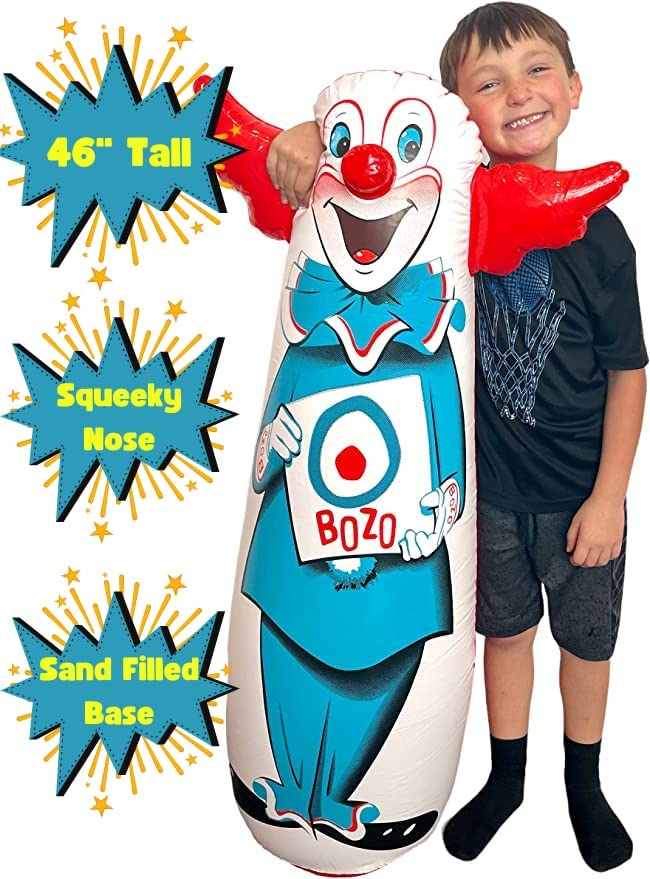 A boy is standing next to a Bozo bop bag. The text reads, '46 inches tall, squeaky nose, sand filled base.'