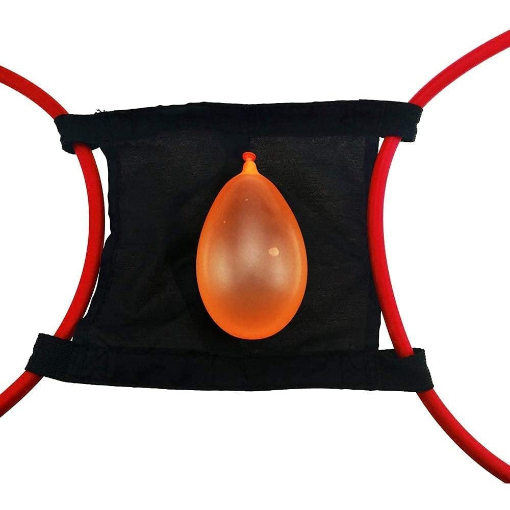 An orange water balloon filled with water is resting on the launchpad of a water balloon launcher.