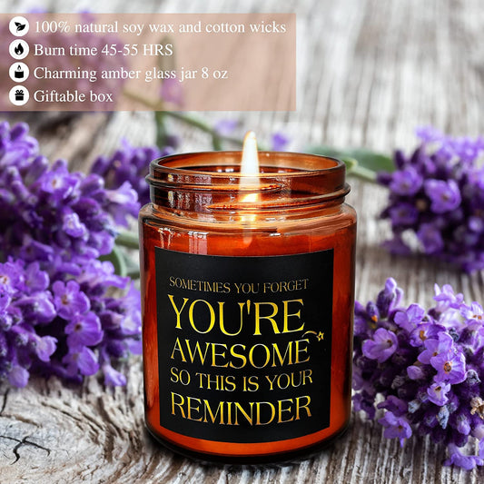 A candle has a message printed on the outside which says, Sometimes You Forget You’re Awesome So This Is Your Reminder.”