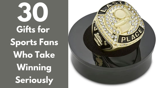 Oversized gold last-place championship ring against a dramatic stadium background, featured in a guide to 30 unusual gifts for sports fans.