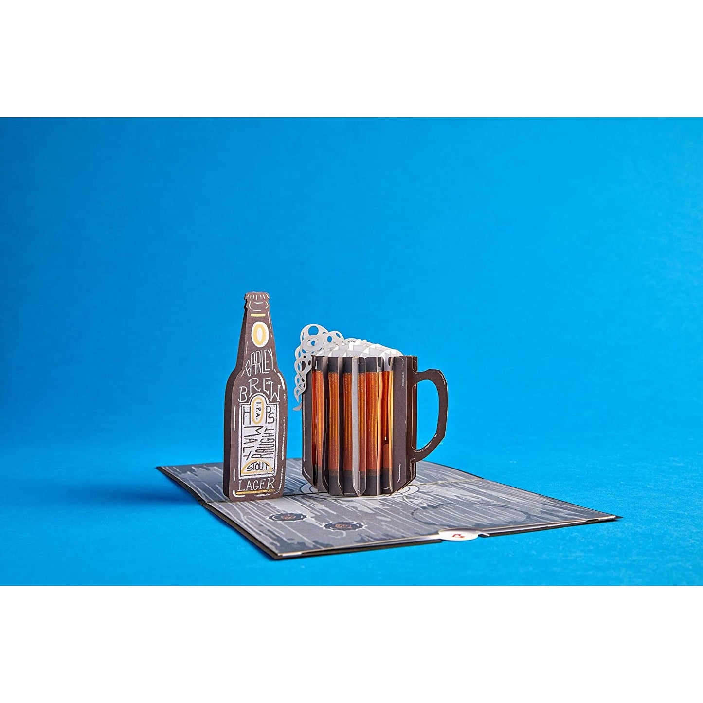 A 3D pop-up greeting card featuring a beer bottle and a beer stein.