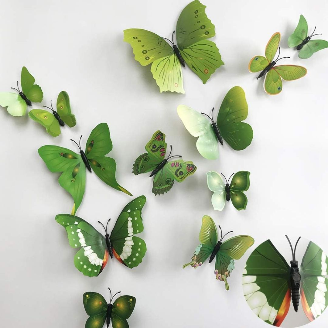 Green butterfly wall decorations on a white background