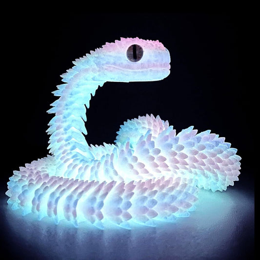 3D printed colorful LED snake fidget toy on a dark background
