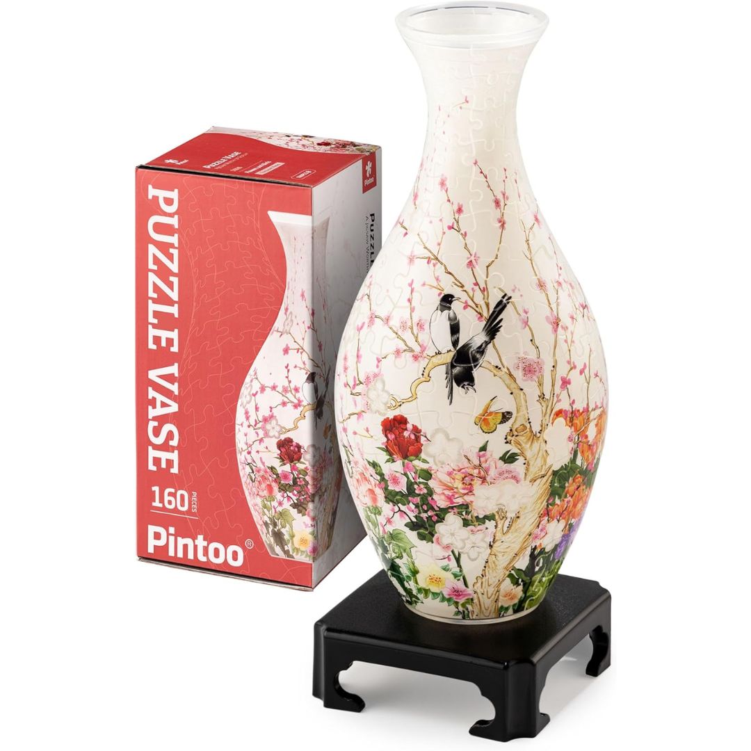 A 3D completed jigsaw puzzle shaped as a vase on a white background.