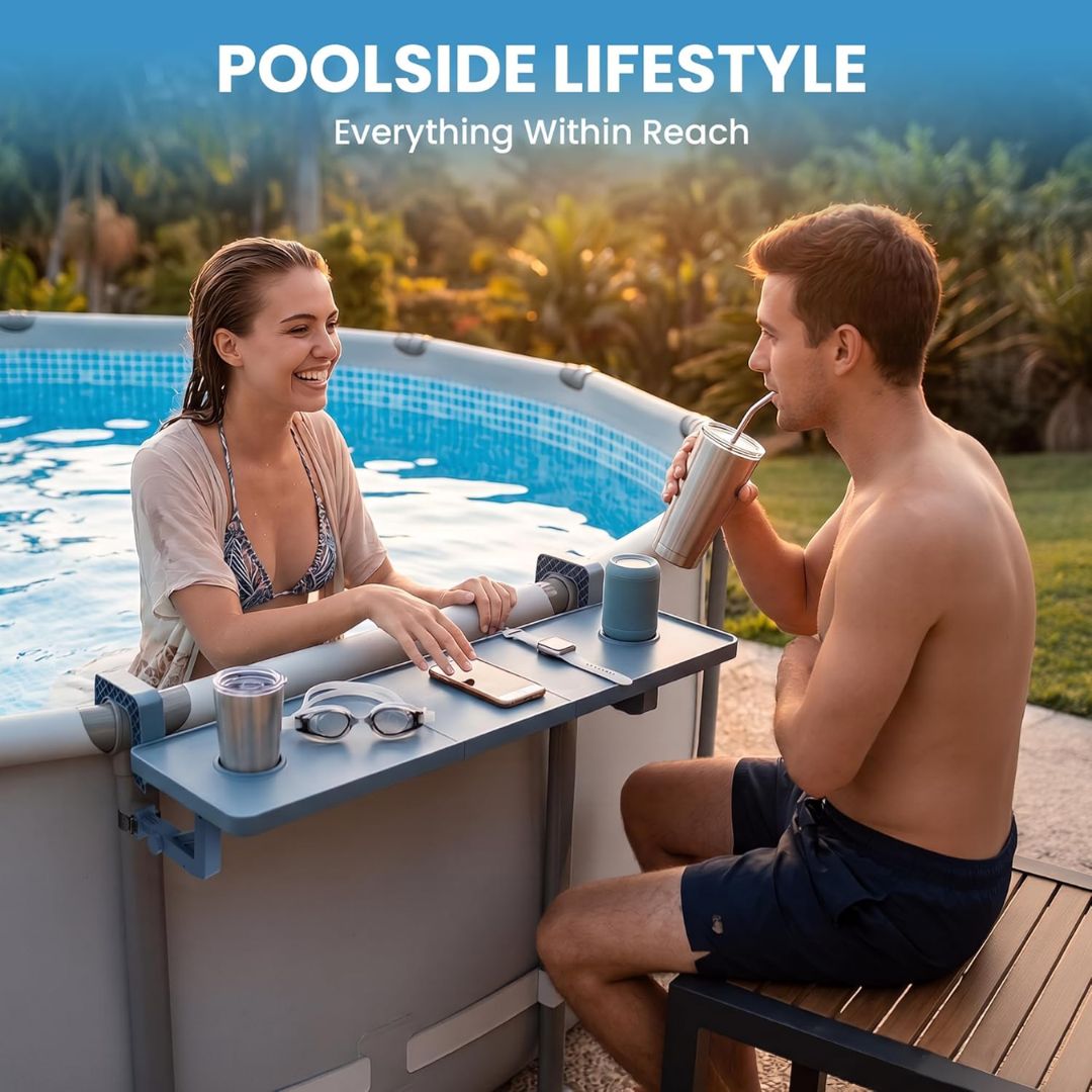 Two people by a poolside with drinks and a tablet, enjoying a poolside lifestyle.