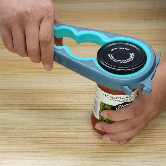 A hand opening a jar using an adjustable multi size lid opener on a wooden background
