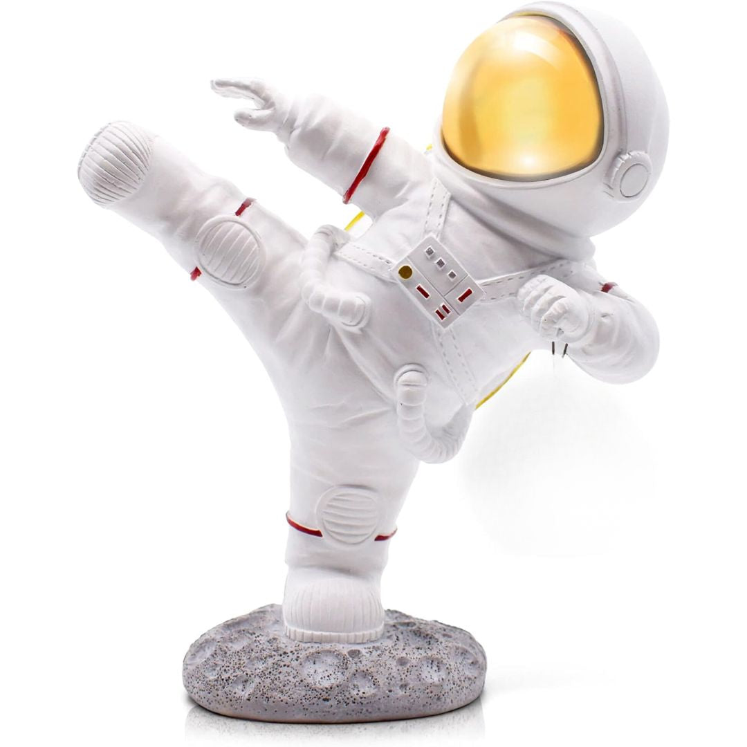 Spaceman figurine doing a kick in the air against a white background