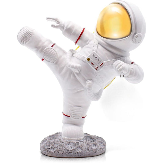 Spaceman figurine doing a kick in the air against a white background