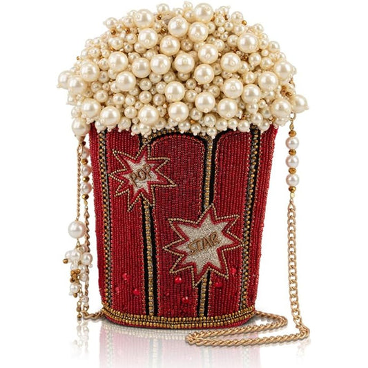 A handbag made with pearls and red beadwork shaped like a bucket of popcorn.
