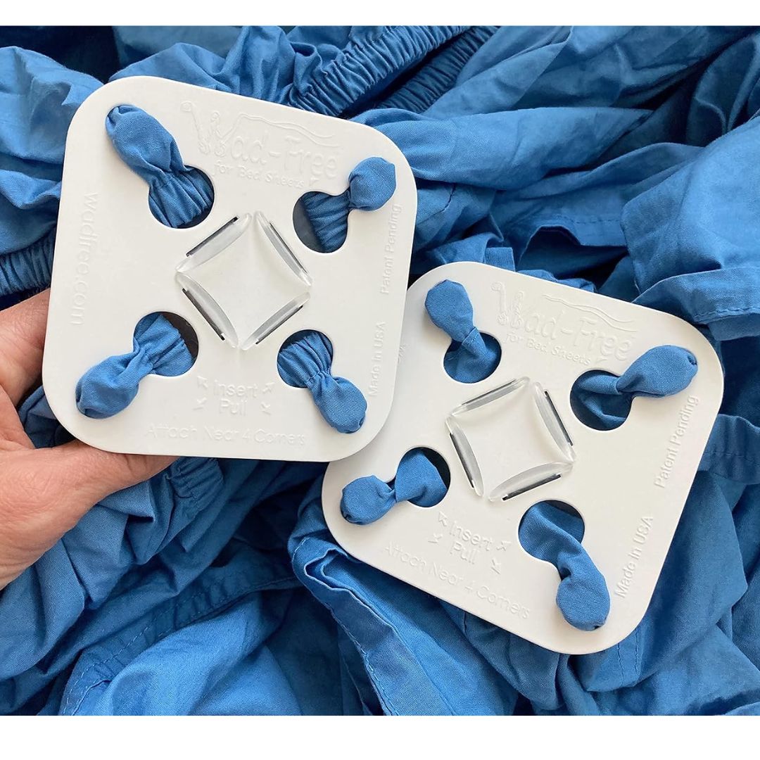 Two white square laundry detanglers with blue sheets using the product