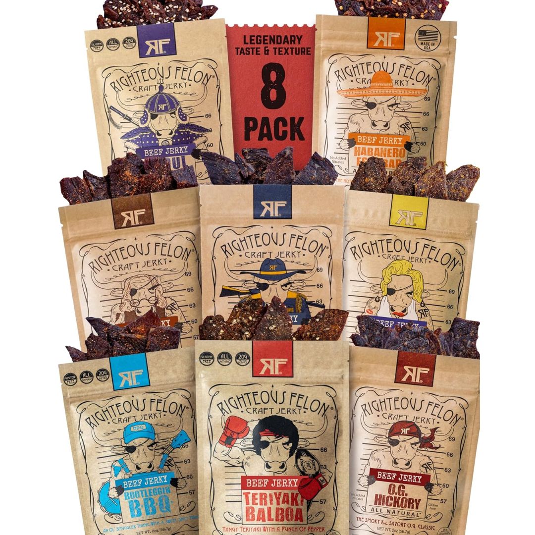 Eight bags of Righteous Felon Crafted Jerky arranged in a 3-by-3 grid on a white background, with several bags open to show the dark brown jerky pieces spilling out. The packaging features different flavor labels in blue, red, yellow, and brown, with a central red banner reading 'LEGENDARY TASTE & TEXTURE 8 PACK'.