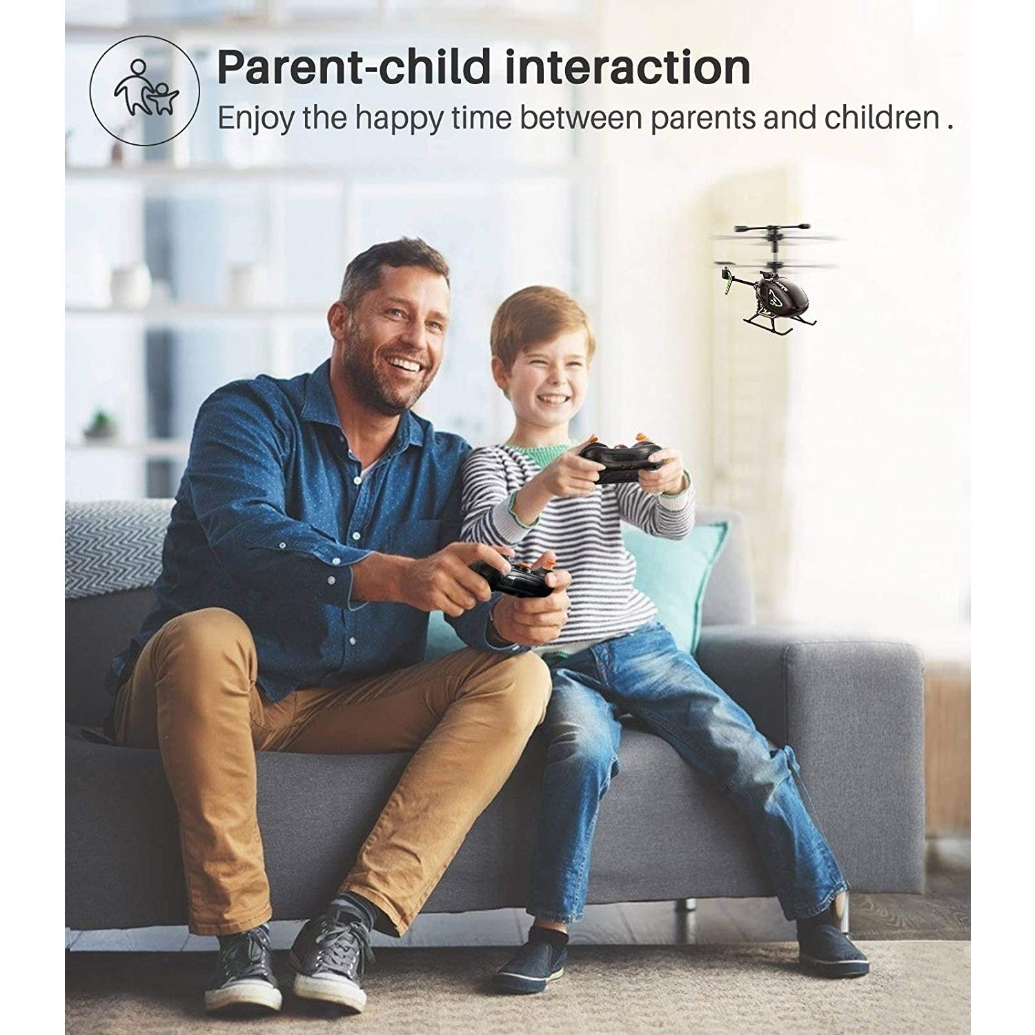 A man and child are holding remote controllers and playing with a mini RC helicopter.
